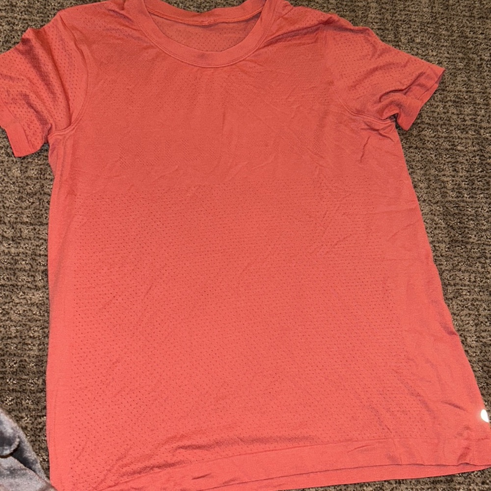 orange/red lululemon shirt